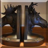 D047. Pair of moose bookends. One antler broken. - $